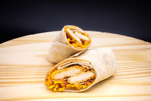 Blazing buffalo chicken wrap on a wood block