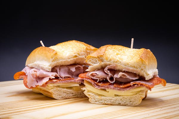 Italian hoagie on a wood block