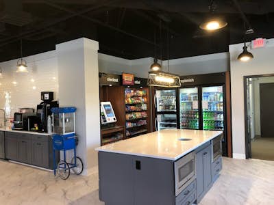 Corporate breakroom with micro market that includes snacks and beverage cooler